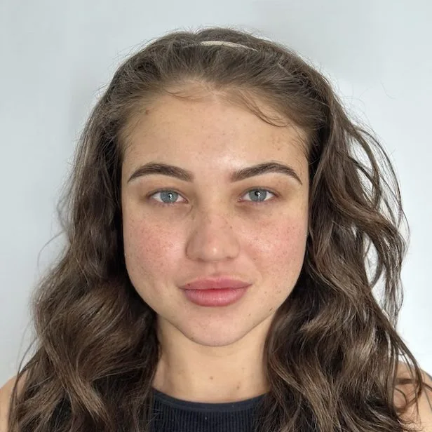 Client front portrait — natural brows before treatment