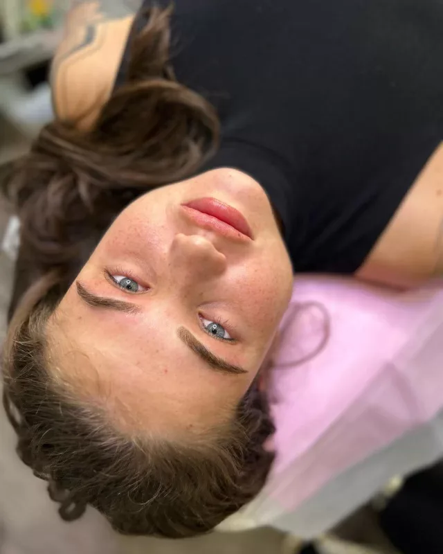Client reclined after fresh ombré brow treatment